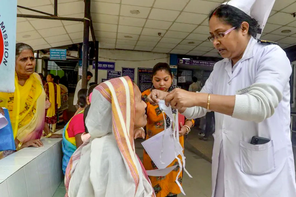 A nurse explains about the virus during a Covid-19 awareness event at a government hospital in Siliguri, Bengal.